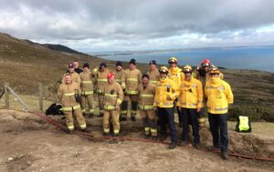 Personnel from NI Fire and Rescue Service and Mourne Heritage Trust (yellow jackets) at a wildfire control plot at Bloody Bridge, Newcastle, Co Down.